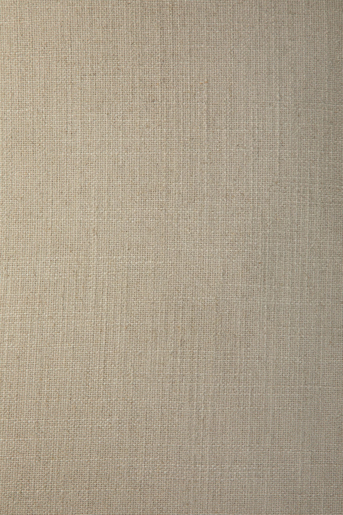 Close-up of the Bone-colored fabric texture on the Ethnicraft Weave sofa | 2 Seater, showcasing visible woven threads that create a natural and soft look. The subtle, uniform pattern evokes high-quality linen-blend upholstery, often seen on Ethnicraft’s removable slipcover designs, resulting in a neutral and inviting background.