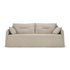 A bone-colored, two-seater Ethnicraft Weave sofa featuring two large back cushions and two side pillows. The sofa showcases a minimalistic design with linen-blend upholstery and a removable slipcover that drapes loosely over the base, extending to the floor.