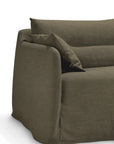 A close-up of the Ethnicraft Weave Sofa | 2 Seater Green showcases its modern olive green fabric upholstery with a matching cushion, soft rounded edges, and a relaxed slipcovered design set against a plain white background.
