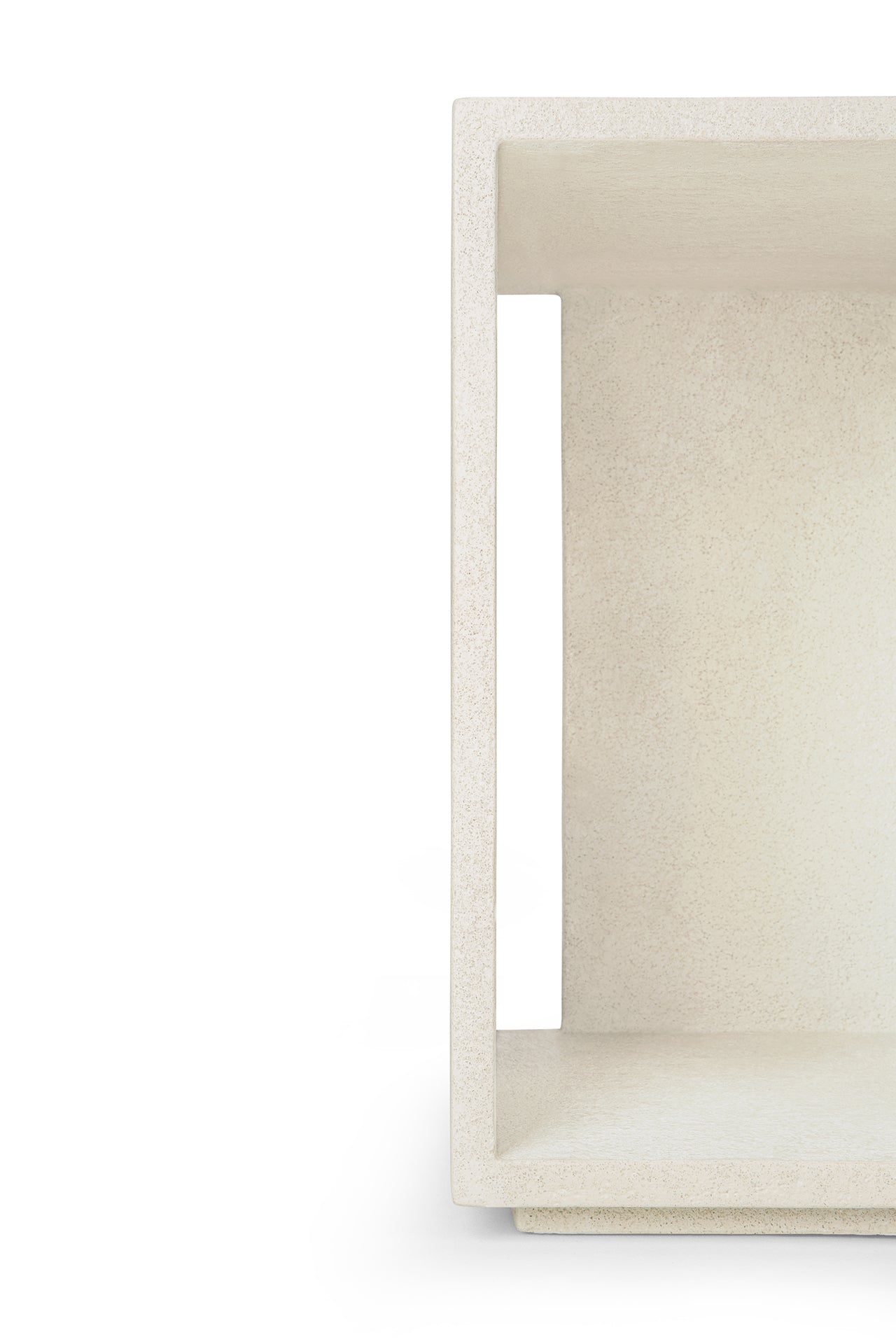 Minimalist image of the Ethnicraft Elements Bedside Table, white and textured, open rectangular design, shown on the right with the left side cropped against a clean white background.