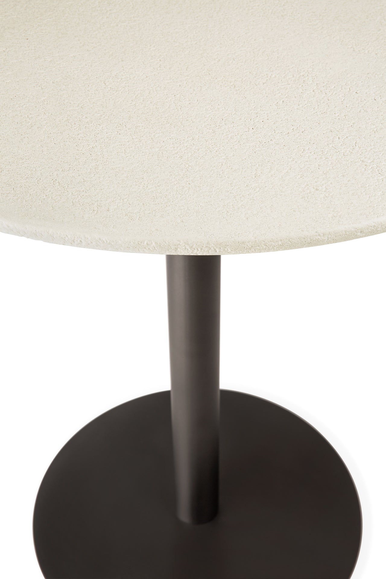 The Ethnicraft Blend Dining Table - Microcement features a round, light-textured tabletop and a black cylindrical pedestal on a circular black metal base, displayed against a white background.