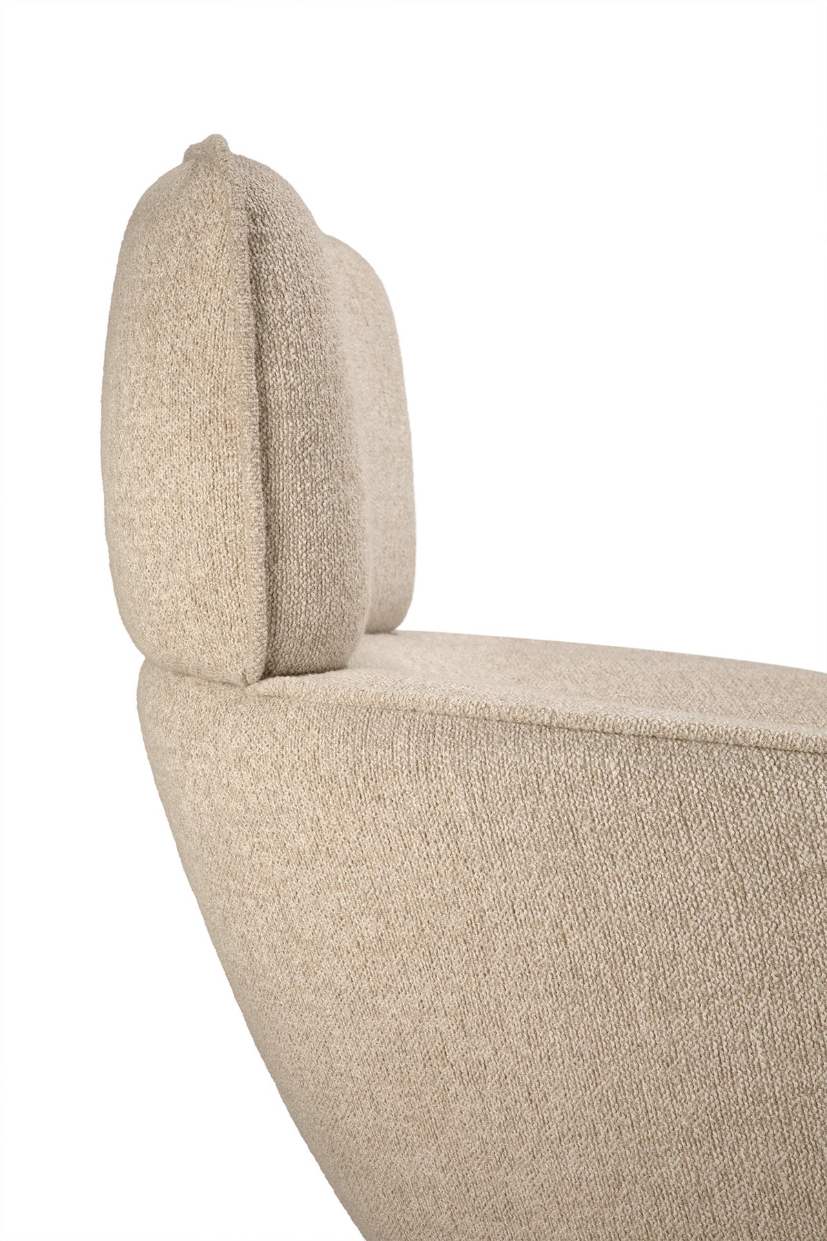 Side view of an Ethnicraft Merge lounge chair featuring an upholstered high backrest and a curved seat, ideal for contemporary interiors.