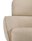 Close-up of a beige Ethnicraft Merge Lounge Chair with a high back and rounded armrest.