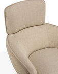 Ethnicraft Merge lounge chair upholstered in beige, featuring a rounded backrest and curved arms for contemporary interiors.