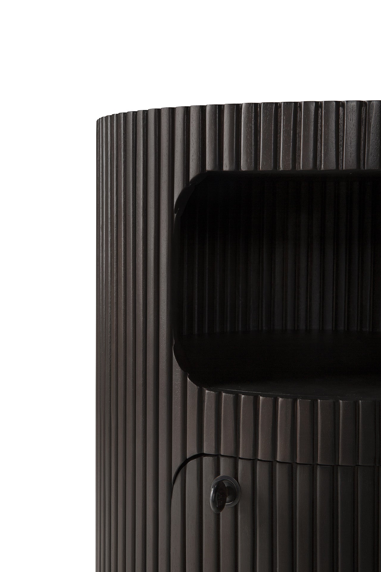 Close-up of the Ethnicraft Boomerang Drawer Unit in dark brown stained mahogany, featuring vertical grooves, an open shelf, and a small round knob on the lower door, set against a white background.