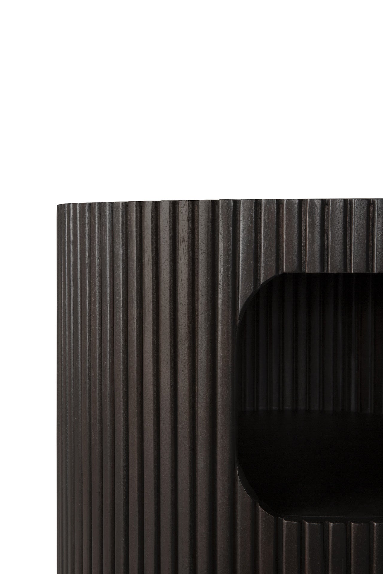 Close-up of the Ethnicraft Boomerang Drawer Unit, a modern, minimalist cylindrical piece in dark brown stained mahogany with vertical grooves and an open shelf on the right.