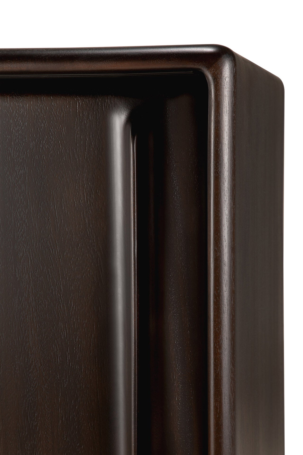 Close-up of the Flow Sideboard by Ethnicraft shows its dark brown, polished mahogany finish, smooth edges, and visible wood grain. Its rectangular, modern design is perfect for fans of vintage-inspired contemporary furniture.