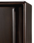 Close-up of the Flow Sideboard by Ethnicraft shows its dark brown, polished mahogany finish, smooth edges, and visible wood grain. Its rectangular, modern design is perfect for fans of vintage-inspired contemporary furniture.