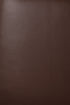 Close-up of the burgundy leather grain texture on a Jack Lounge Chair - Burgundy Leather by Ethnicraft.