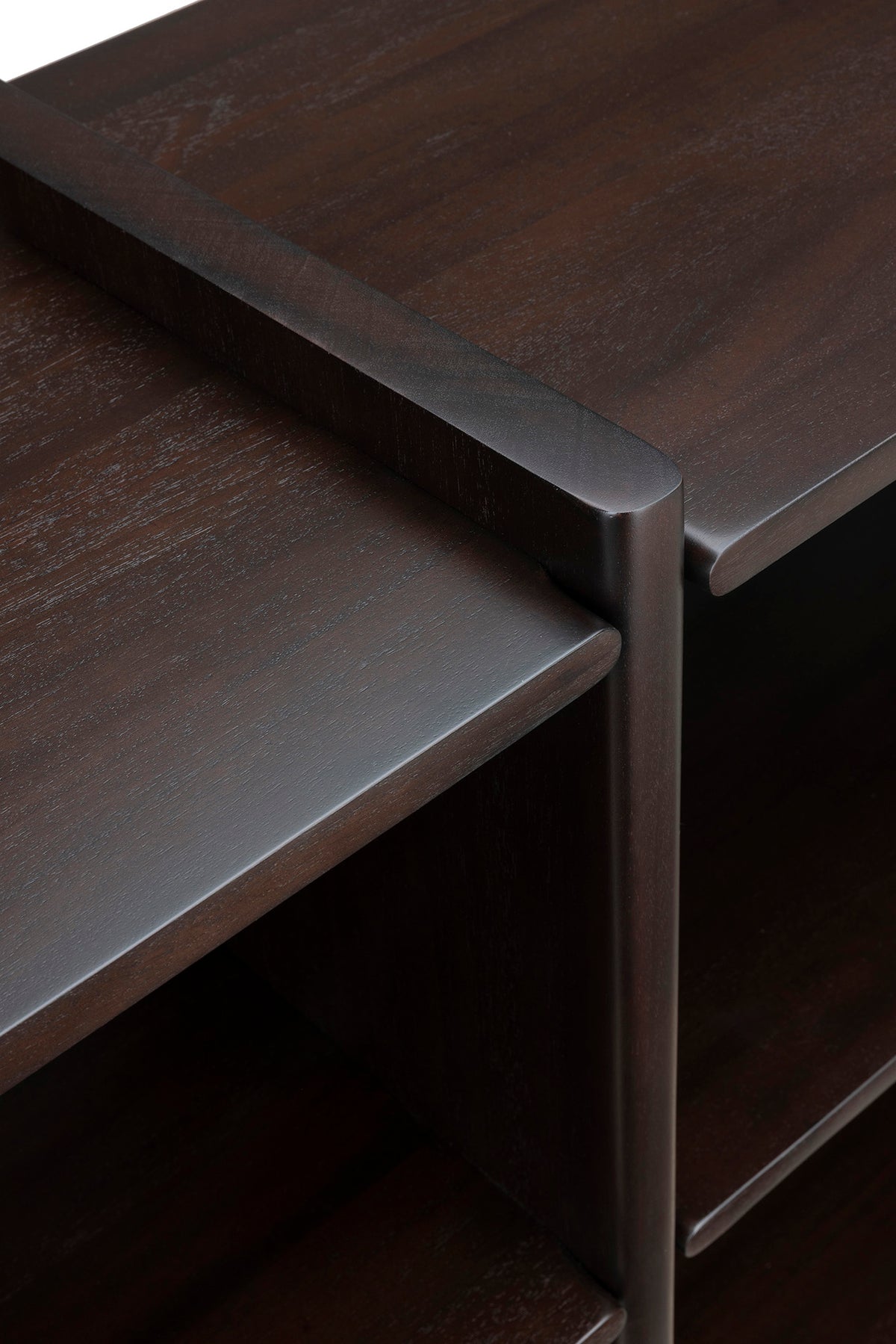 Close-up of the Ethnicraft Mortise Rack showing an heirloom-quality dark wood mortise and tenon joint where the shelf meets the vertical support.