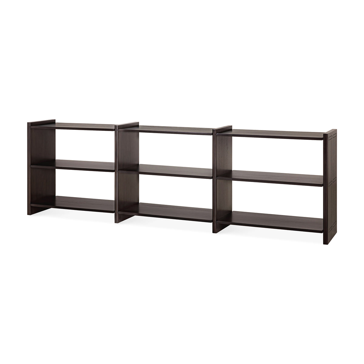 A low, three-section Ethnicraft Mortise Rack in a dark, heirloom-quality finish with two shelves per section.