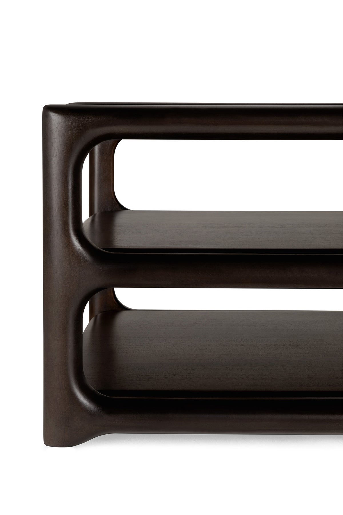 Close-up of the Eda Coffee Table by Ethnicraft, featuring a modern design with dark wood, rounded edges, and two tiers. The smooth curves and clean lines highlight its heirloom-quality construction and refined European craftsmanship.