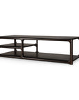 Introducing the Eda Coffee Table by Ethnicraft—a modern dark wood piece with rounded edges, minimalist design, and European-inspired craftsmanship. This heirloom-quality table combines timeless aesthetics with everyday functionality, featuring two large open sections alongside two smaller shelves on the left for versatile storage.