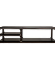 The Eda Coffee Table by Ethnicraft is a dark brown, rectangular piece with rounded edges and a sleek, modern design. Expertly crafted with renowned European craftsmanship, this stylish table echoes the timeless appeal of classic Ethnicraft furniture. Featuring open shelving on both sides—the left side offers two shelves while the right side provides one wide shelf—it’s perfect for showcasing heirloom-quality items in any contemporary living space.