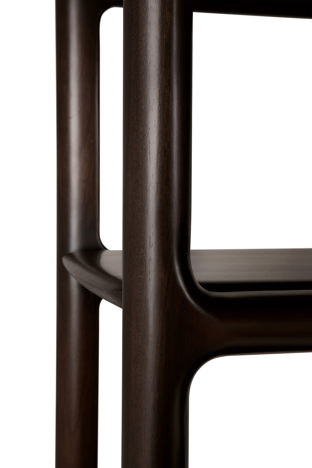 Close-up of an Eda Console | Wide dark mahogany rack console table, showing the rounded corner and shelf joint.