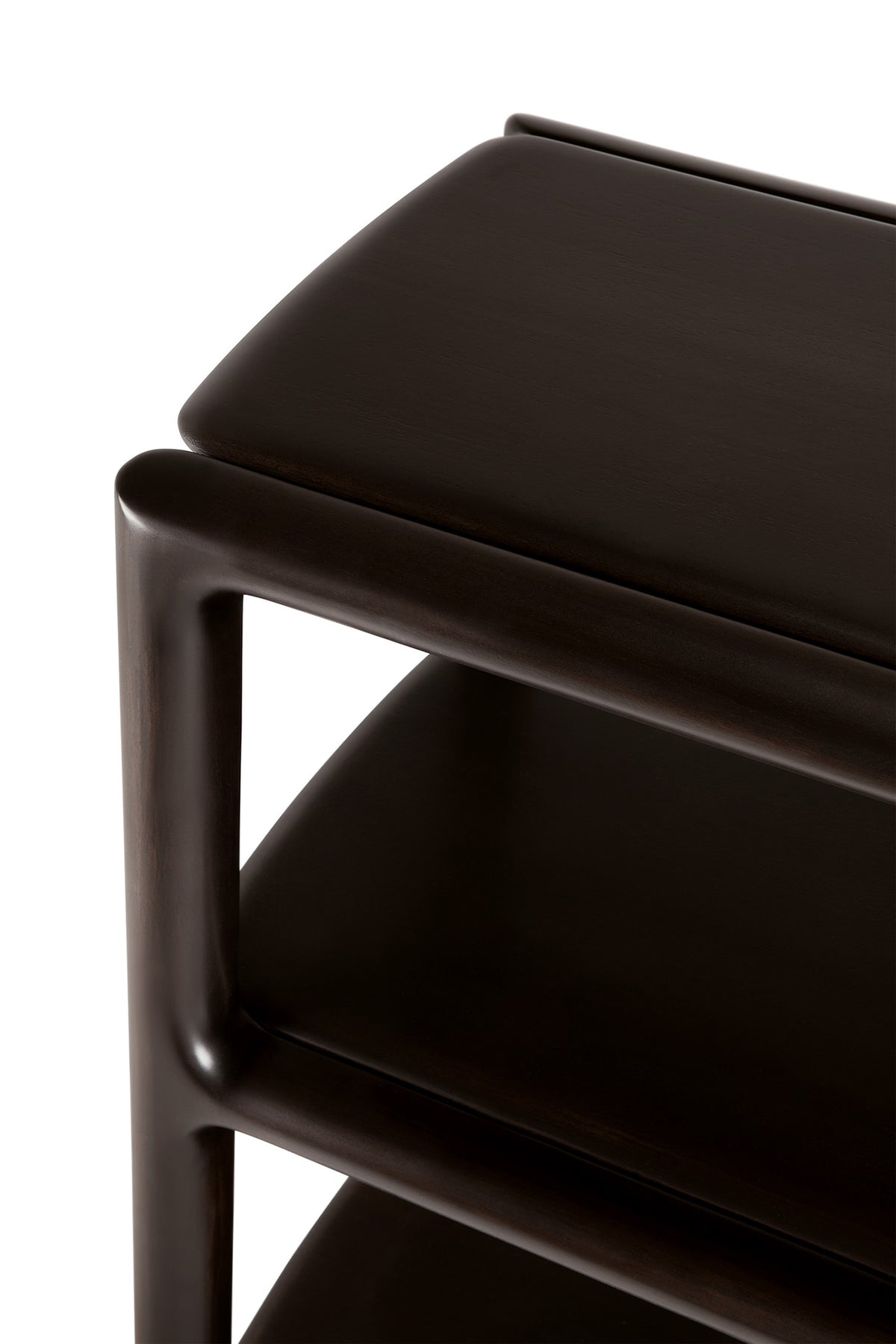 Close-up of the Eda Console | Wide, a dark mahogany rack console table with a thick top surface, a lower shelf, and heirloom-quality rounded corner joinery.