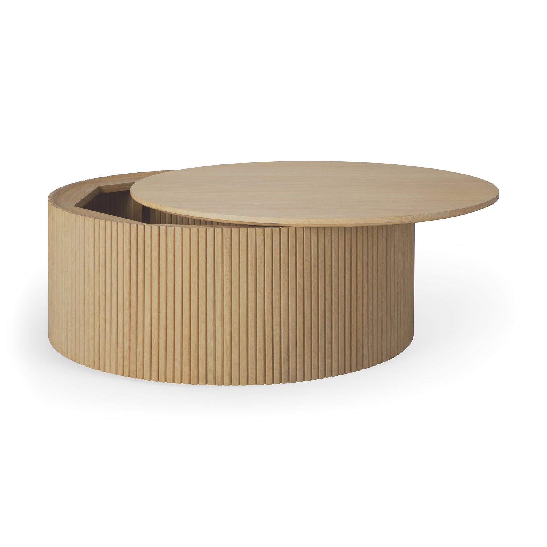 The Roller Max Coffee Table - Oak by Ethnicraft is a round, solid oak coffee table with vertical grooves and a lift-top lid revealing hidden storage—modern, stylish, and functional for any living space.