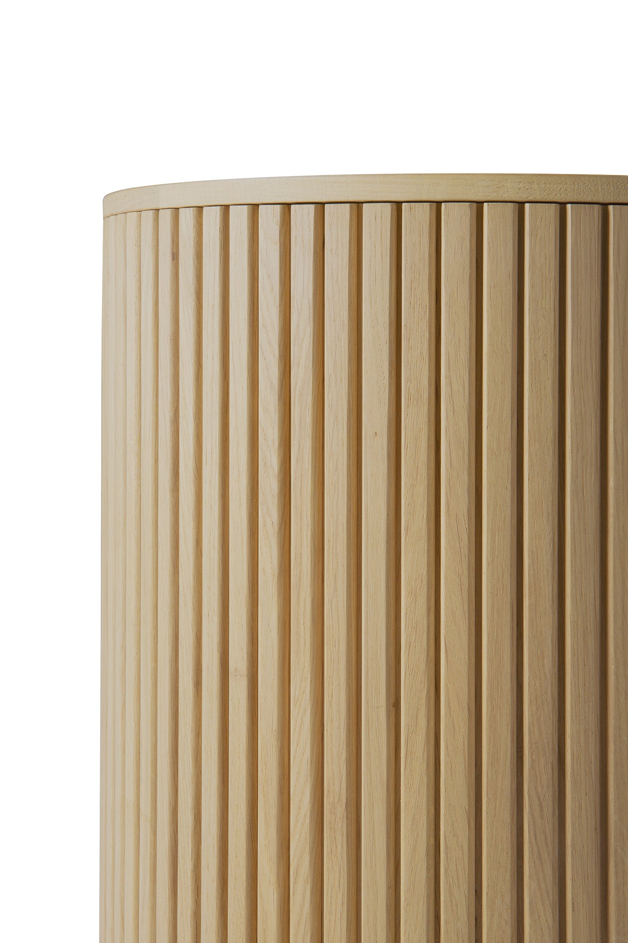 Close-up of the Ethnicraft Roller Max Side Table in solid oak, featuring vertical grooves and a light, natural finish that highlights its craftsmanship. The cylindrical table is photographed against a plain white background.