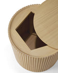 The Ethnicraft Roller Max Side Table - Oak features vertical grooves, a sliding lid, and hidden angular storage inside—echoing Ethnicraft's refined design and offering stylish, functional storage as a versatile side table.