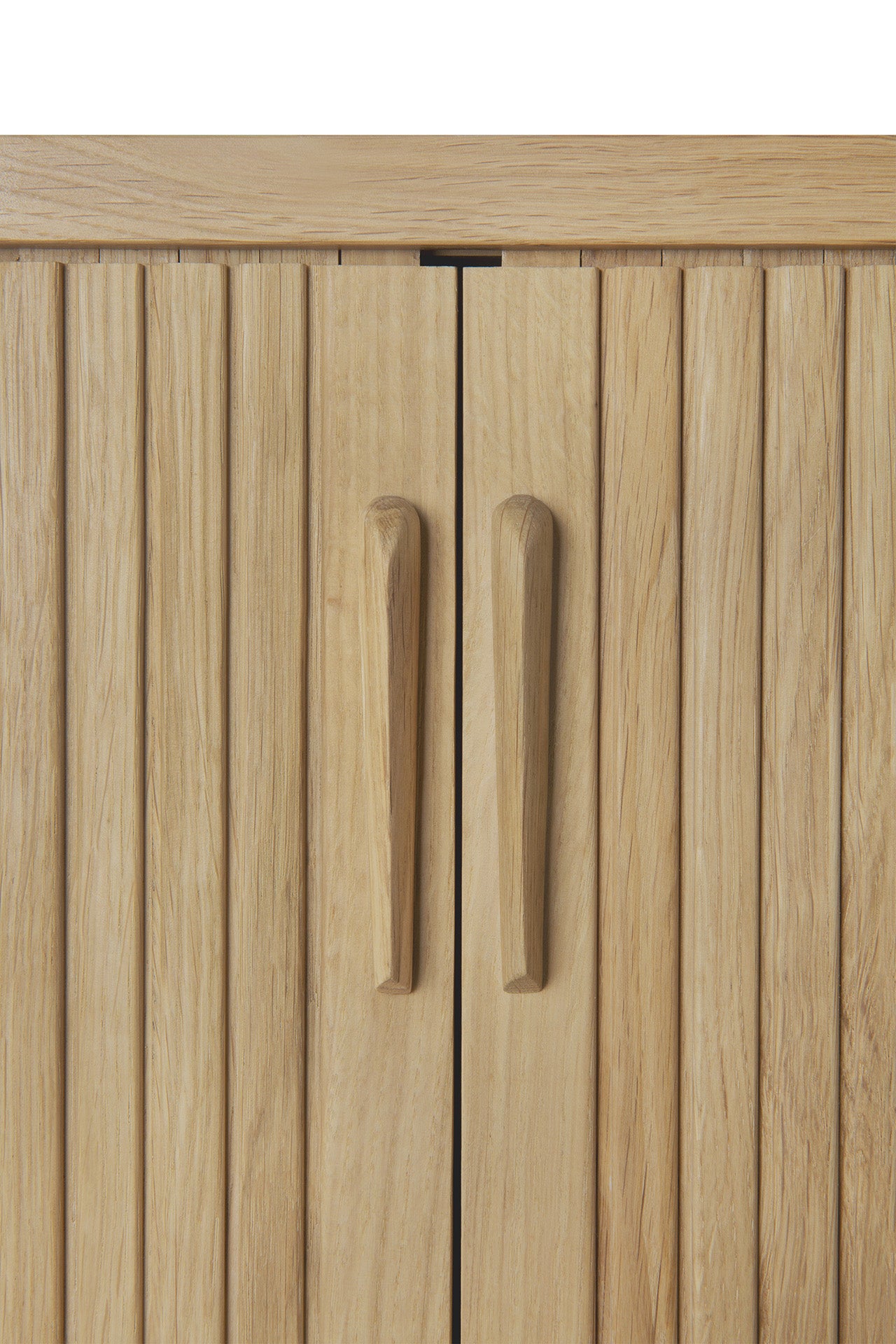 Close-up of two vertical wooden cabinet doors with grooved panels and matching handles in light-toned wood, featured on the Ethnicraft Roller Max Sideboard.
