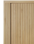 Close-up of the Ethnicraft Roller Max Sideboard’s wooden surface, which features a light natural finish and evenly spaced vertical slats that create a modern, textured look.