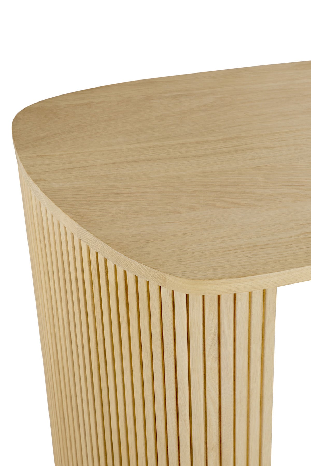 A close-up of the Ethnicraft Roller Max Desk | Oak displays its smooth, rounded top and vertical slatted paneling along the side, crafted from light oak wood.