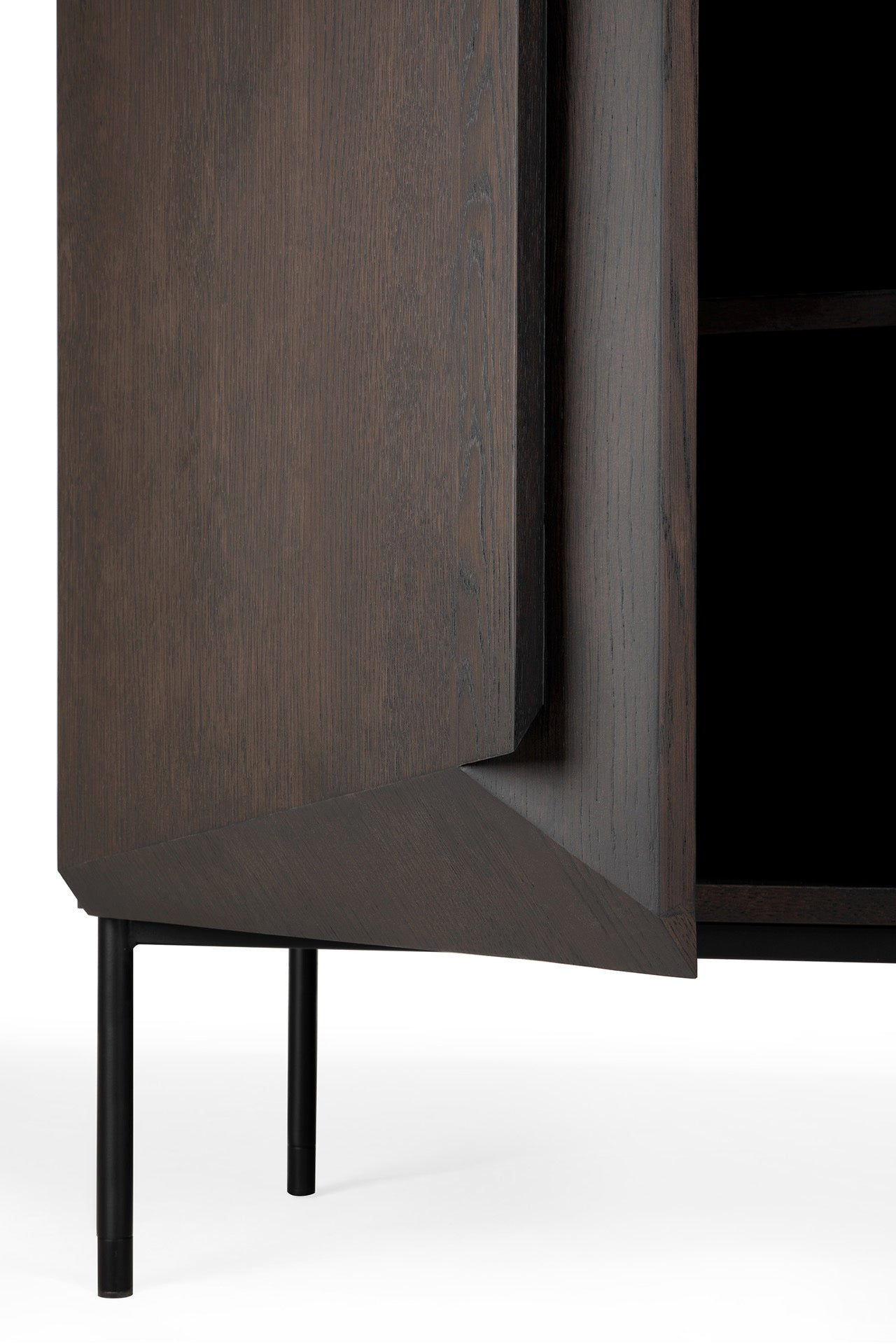 A close-up of the Ethnicraft Stairs cupboard in Oak Brown, showcasing its adjustable shelves and sleek push-to-open doors.