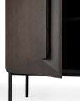 A close-up of the Ethnicraft Stairs cupboard in Oak Brown, showcasing its adjustable shelves and sleek push-to-open doors.