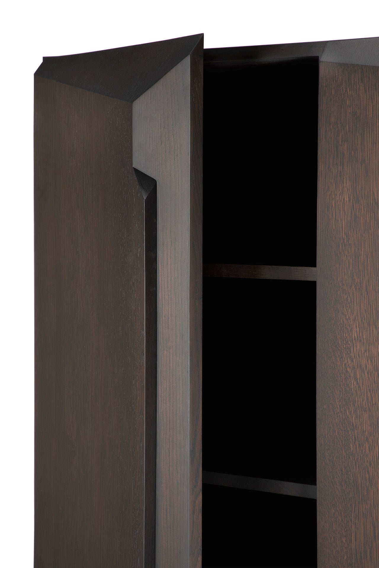 A close-up of the Ethnicraft Stairs cupboard in Oak Brown shows its door open to reveal two adjustable shelves, highlighting its modern, angular design with sharp edges and a smooth matte finish.