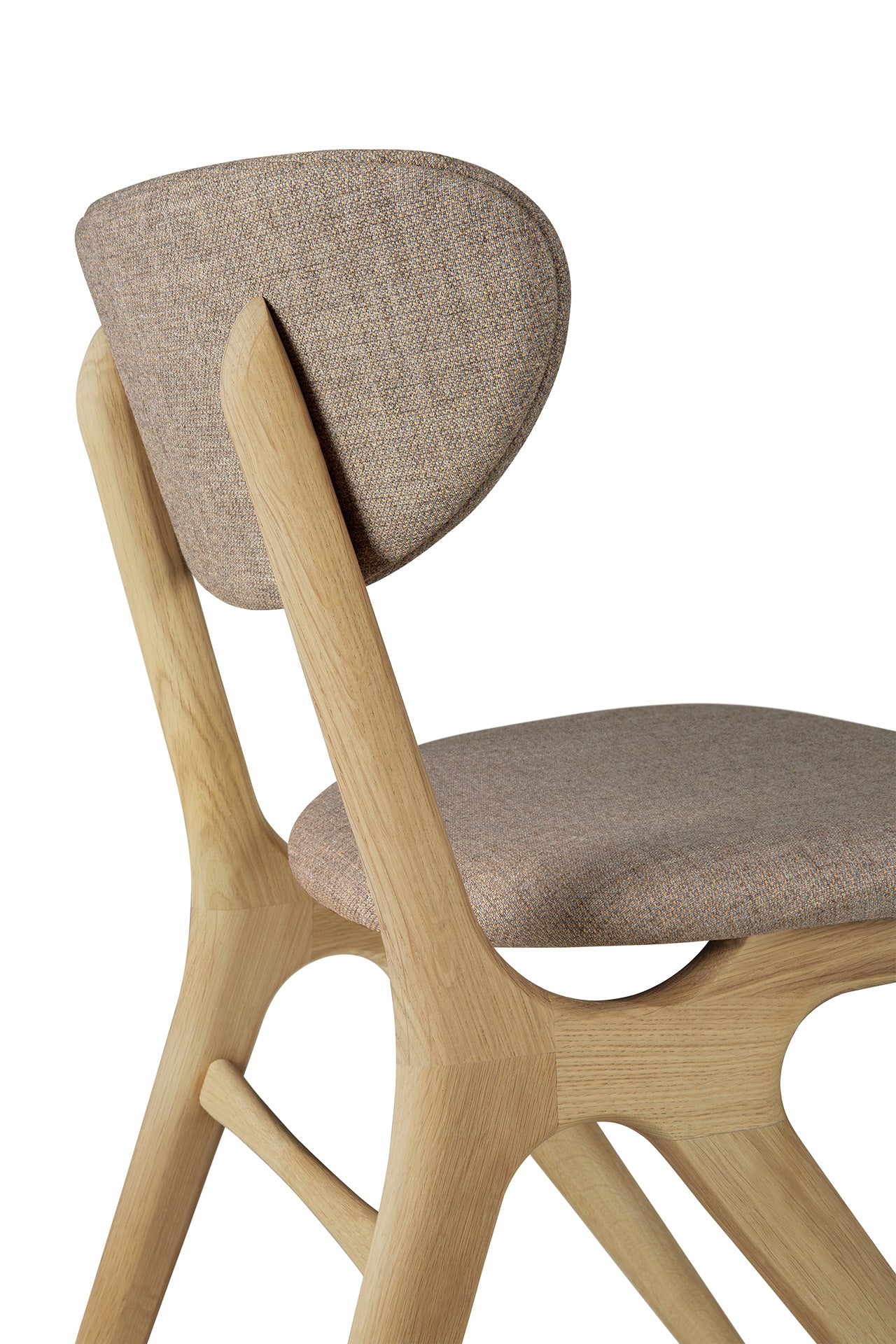 A close-up side view of the Ethnicraft Eye Dining Chair – Oak with Warm Grey Fabric highlights its solid oak frame, curved upholstered seat and backrest, smooth rounded edges, and elegant minimalist design.