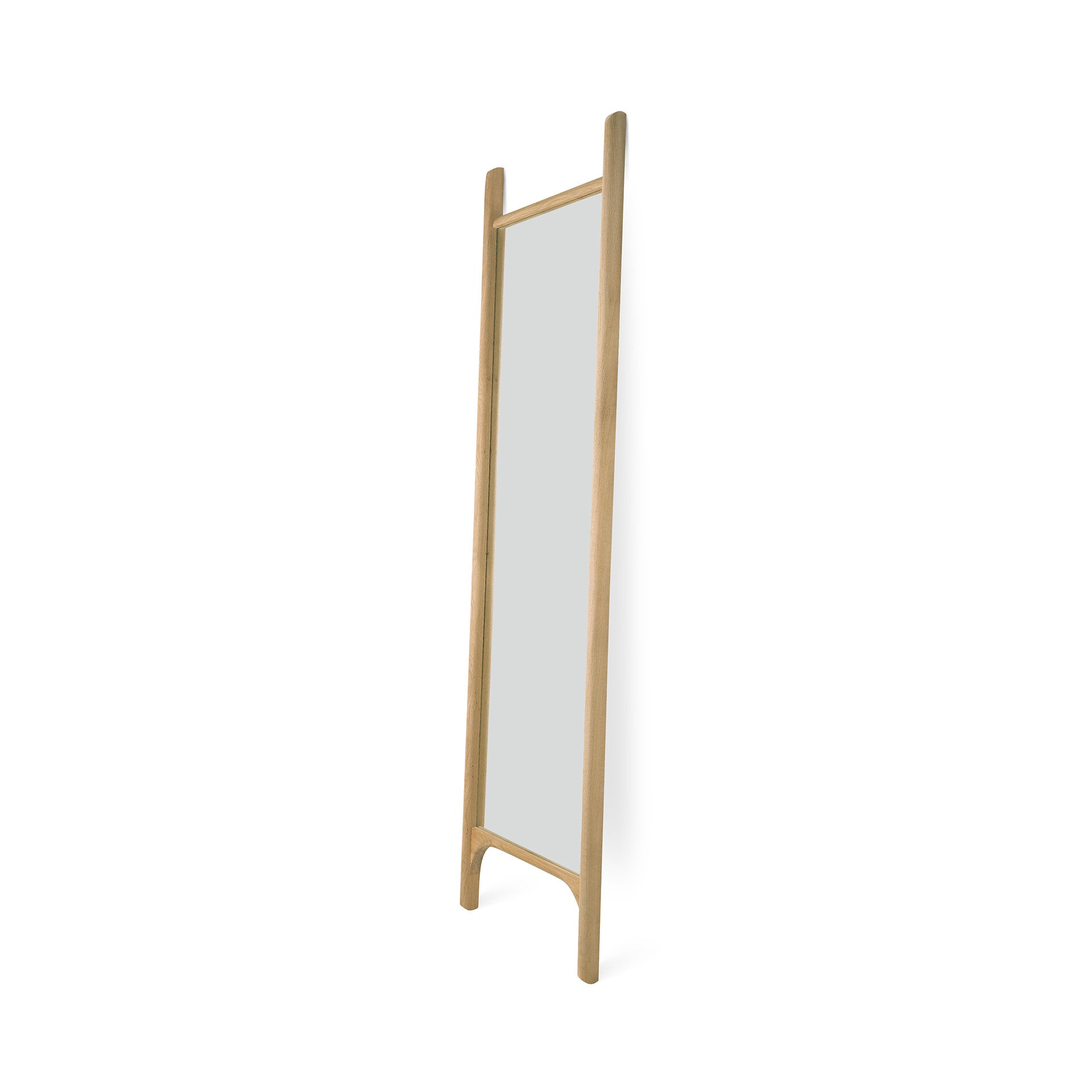 The Ethnicraft PI Floor Mirror - Oak features a tall, rectangular design with a solid oak frame and two vertical legs. Its polished, imperfect finish highlights the mirror’s minimalist and modern aesthetic.
