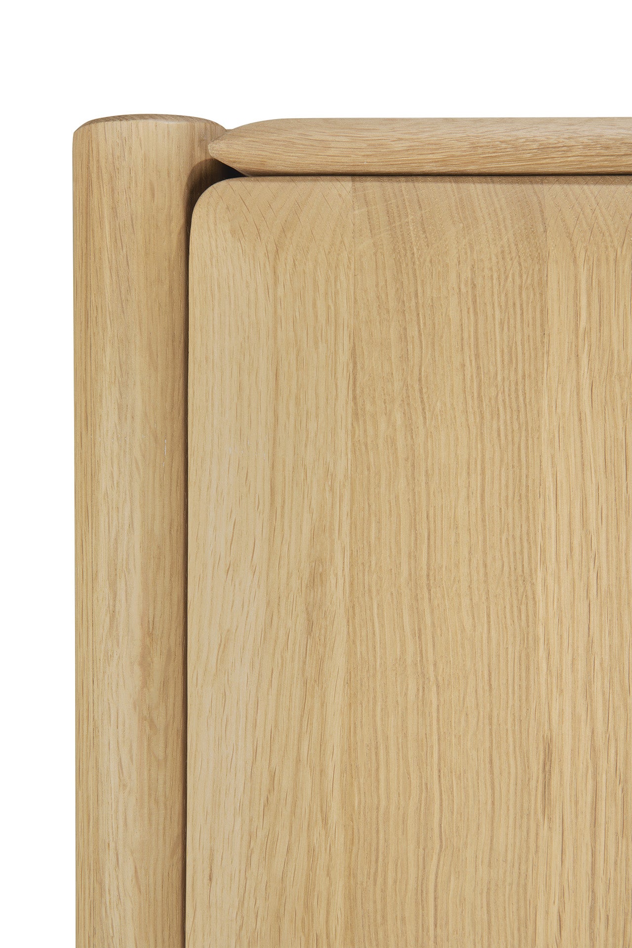 Close-up of the Ethnicraft PI Cupboard - Oak, featuring smooth, rounded corners and edges that highlight its natural wood grain and minimalist design—a refined piece of handcrafted storage furniture.