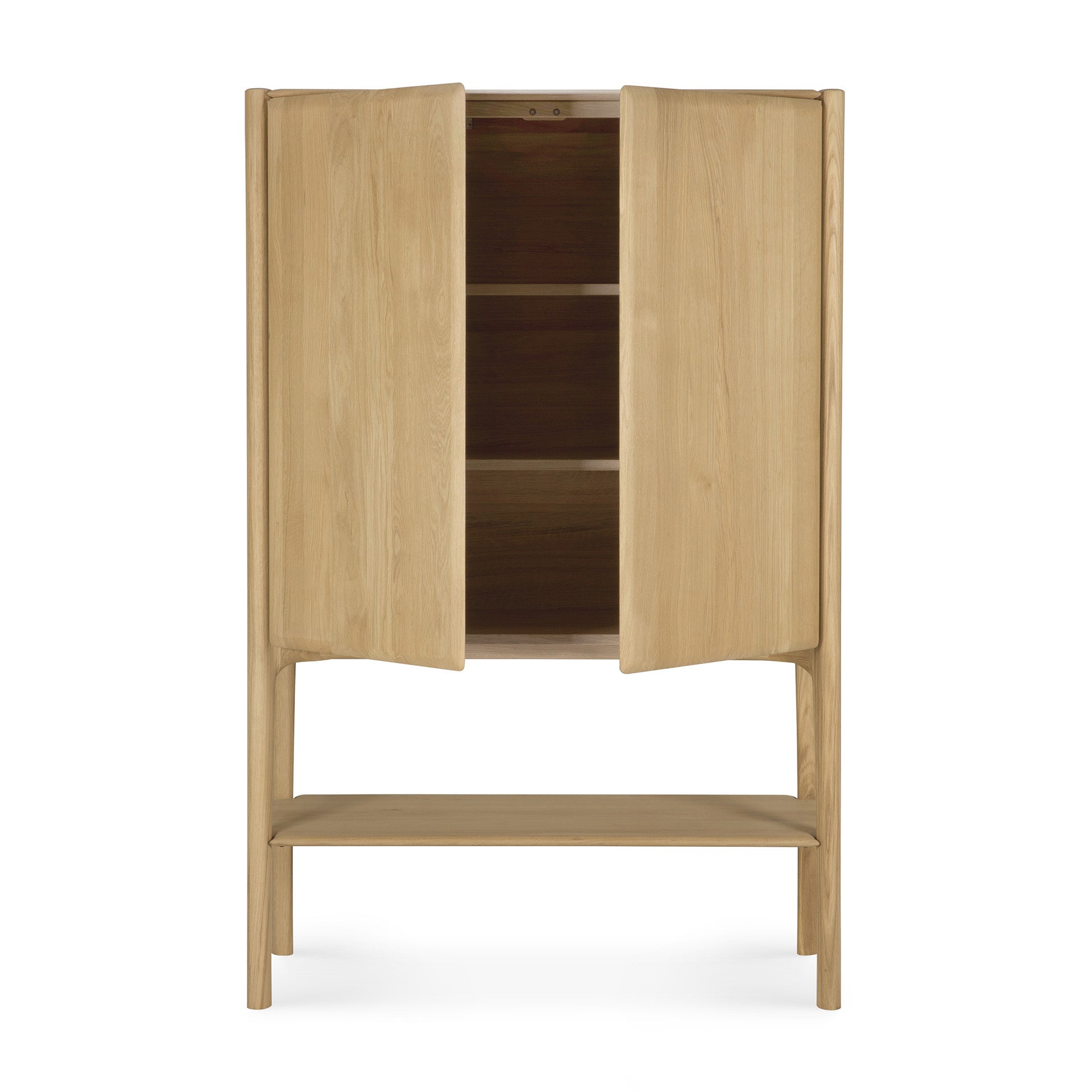 The Ethnicraft PI Cupboard - Oak features two doors, two interior shelves, a lower open shelf, and stands on four legs. Crafted from solid oak, it boasts a simple, modern design.