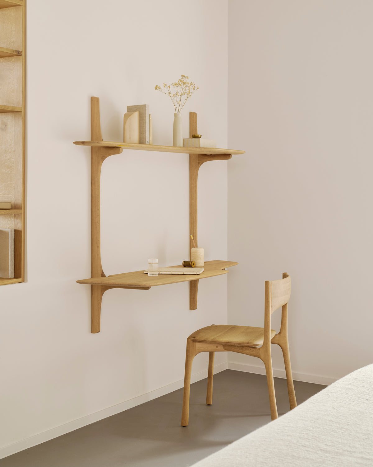 Ethnicraft PI Wall Mounted Desk in solid oak featuring two shelves and a matching wooden chair.