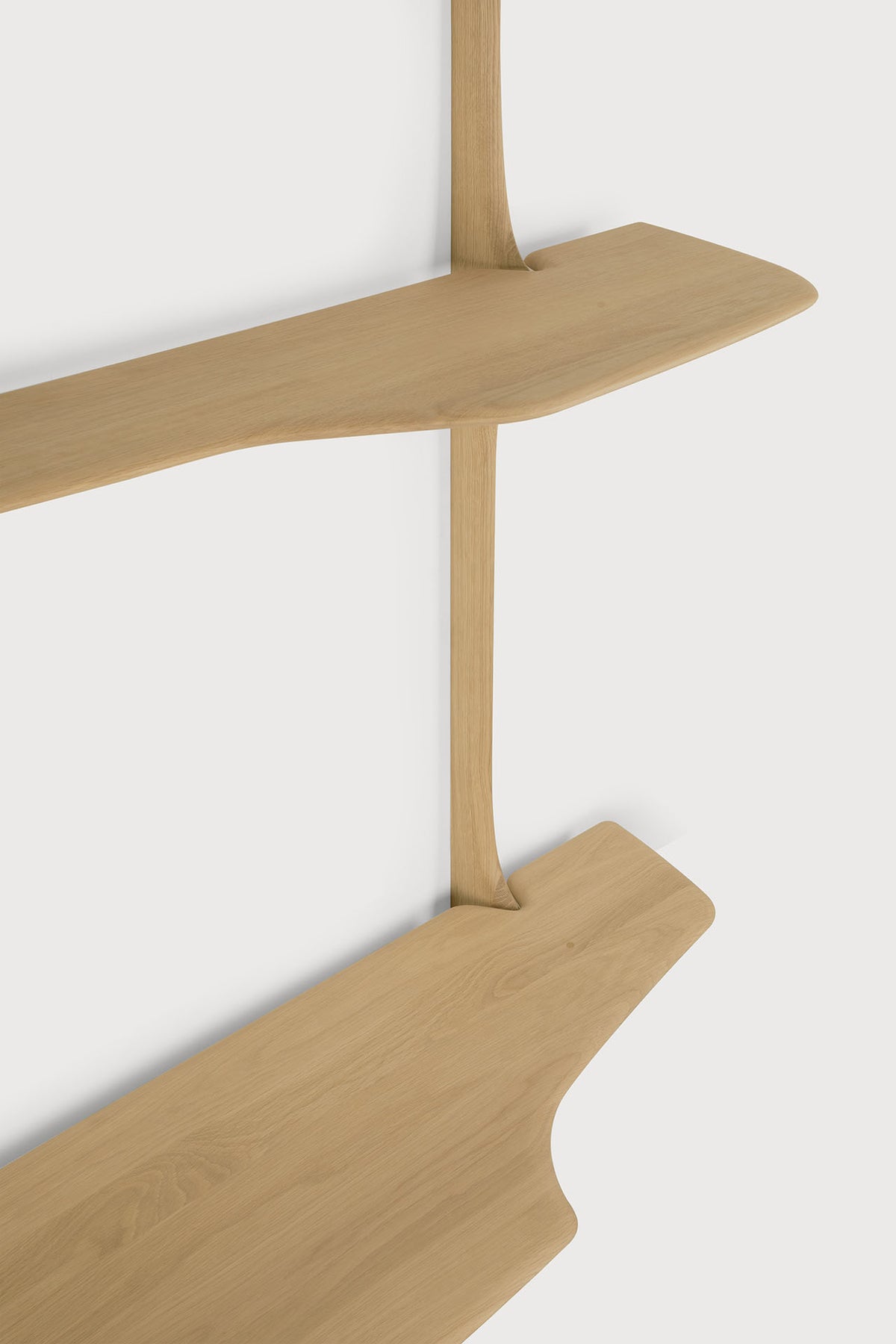 Two Ethnicraft PI Wall Mounted Desk shelves in light wood with organic, curved edges, held by a single vertical support piece.