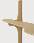 Ethnicraft PI Wall Mounted Desk, a solid oak shelf with a curved, organic design supported by a central vertical pillar.