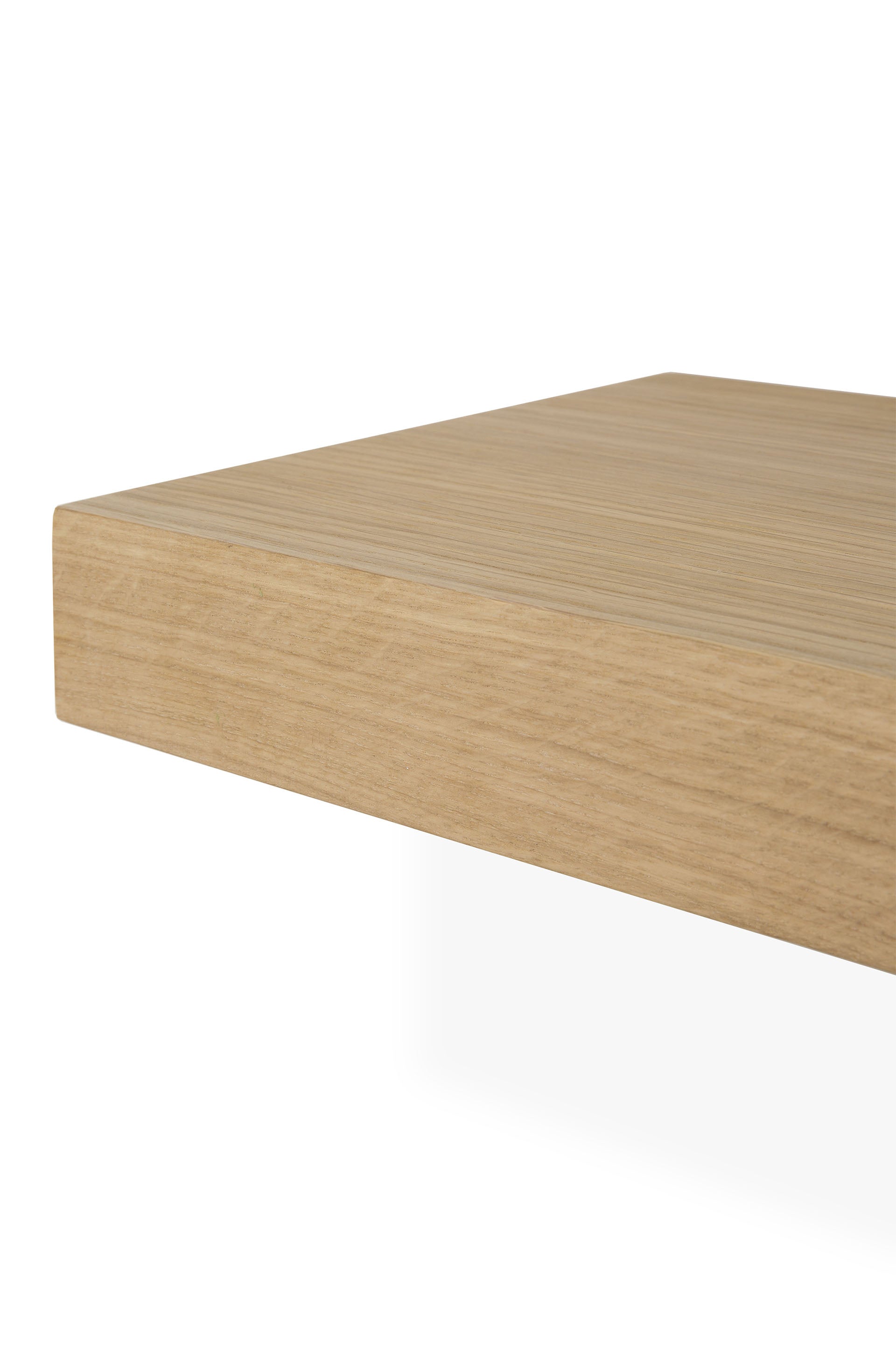 A close-up of the corner of the Ethnicraft Wall Shelf - Oak, crafted from European oak with a light natural finish, set against a white background.