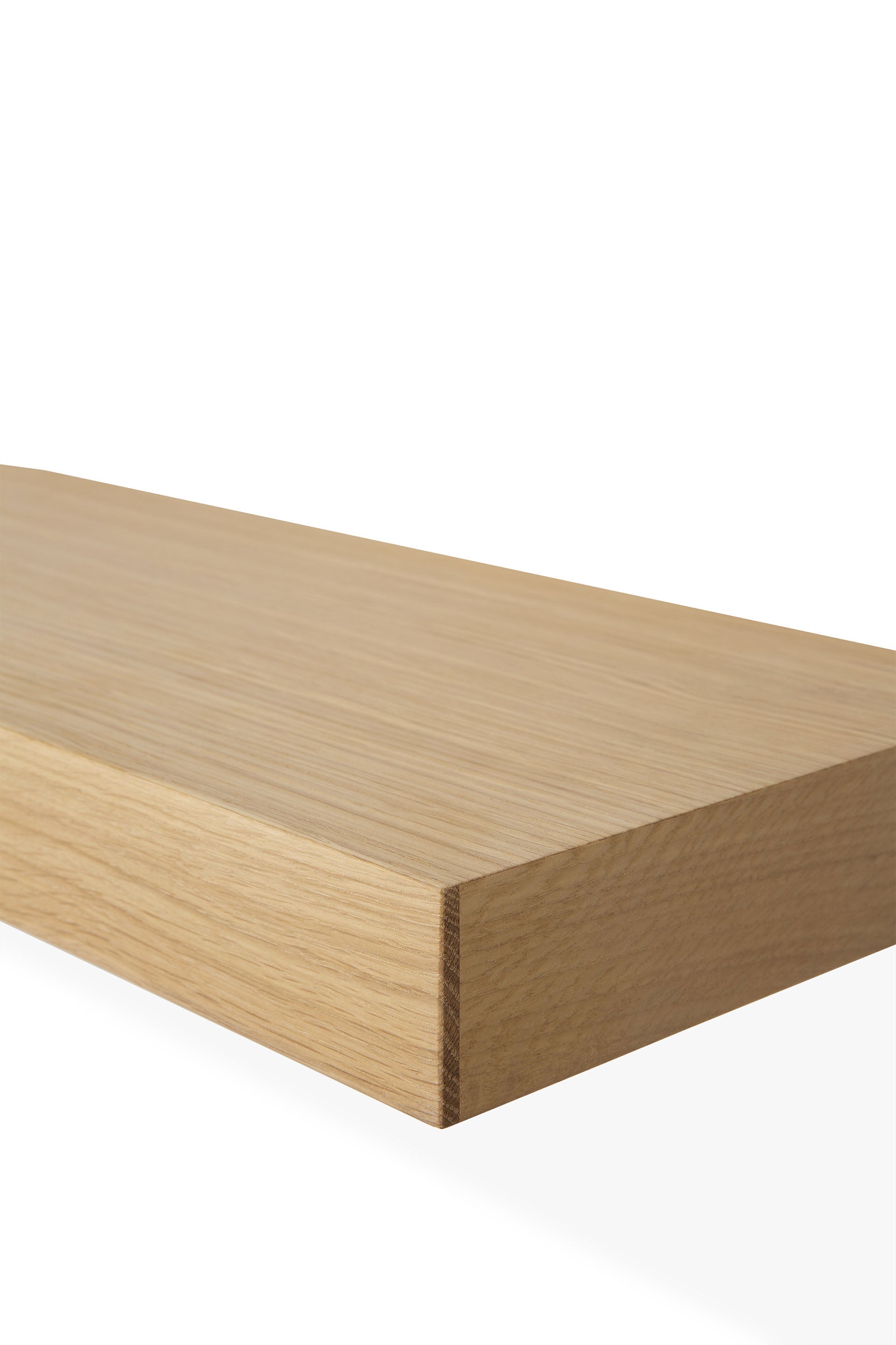 A close-up of the corner of the Ethnicraft Wall Shelf - Oak, featuring a light European oak finish, displayed against a plain white background.