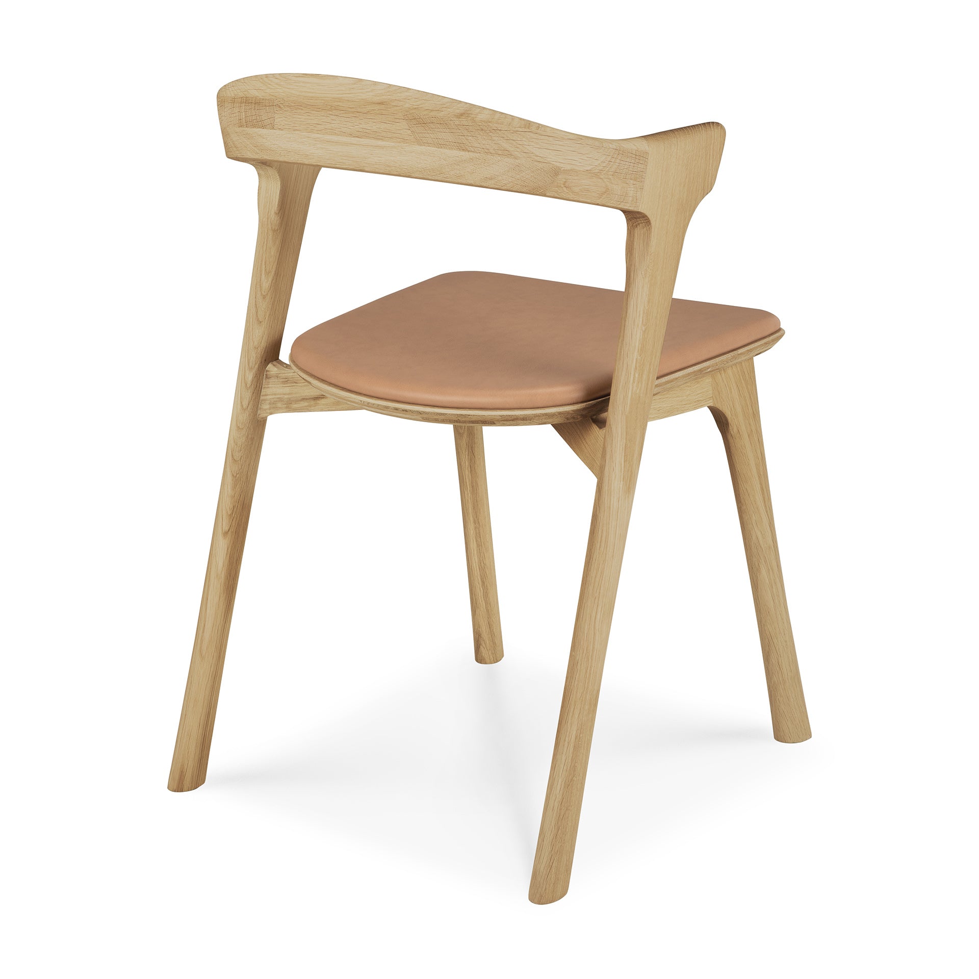 The Ethnicraft Bok Dining Chair features solid oak construction, angled legs, a curved backrest, and a Sienna leather seat. Shown from the rear side angle against a white background.