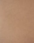 Close-up of light brown Sienna leather with natural grain and slight color variations, as featured on the Ethnicraft Bok Dining Chair crafted from solid oak.