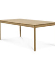 The Ethnicraft Bok Dining Table - Oak features a minimalist rectangular design with four straight legs, crafted from solid oak with a light finish and smooth surfaces—ideal for dining or workspaces.