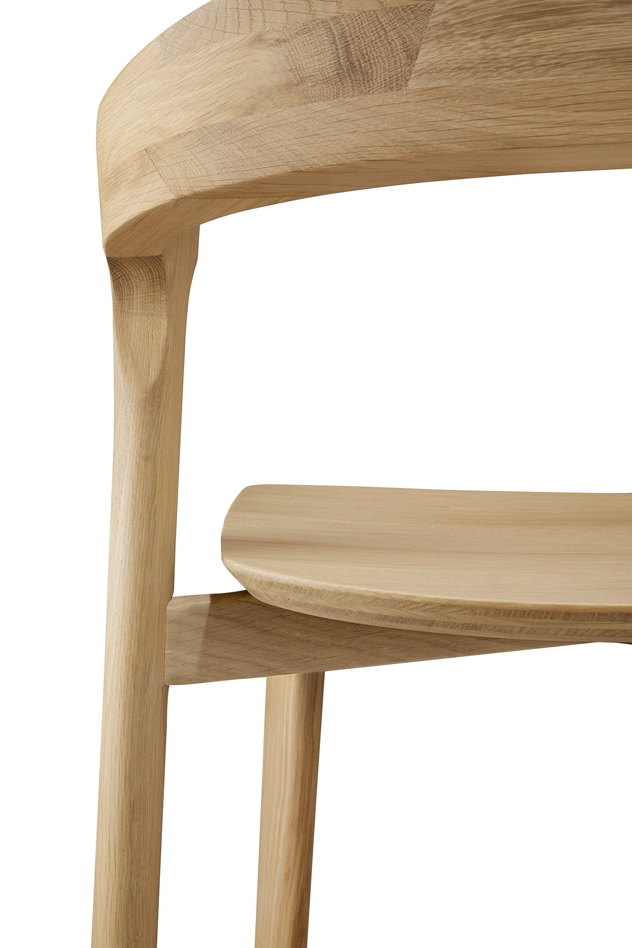 Close-up of the Ethnicraft Bok counter stool, crafted from solid oak with a curved backrest and smooth, light wood finish, showcasing its craftsmanship and clean design lines.