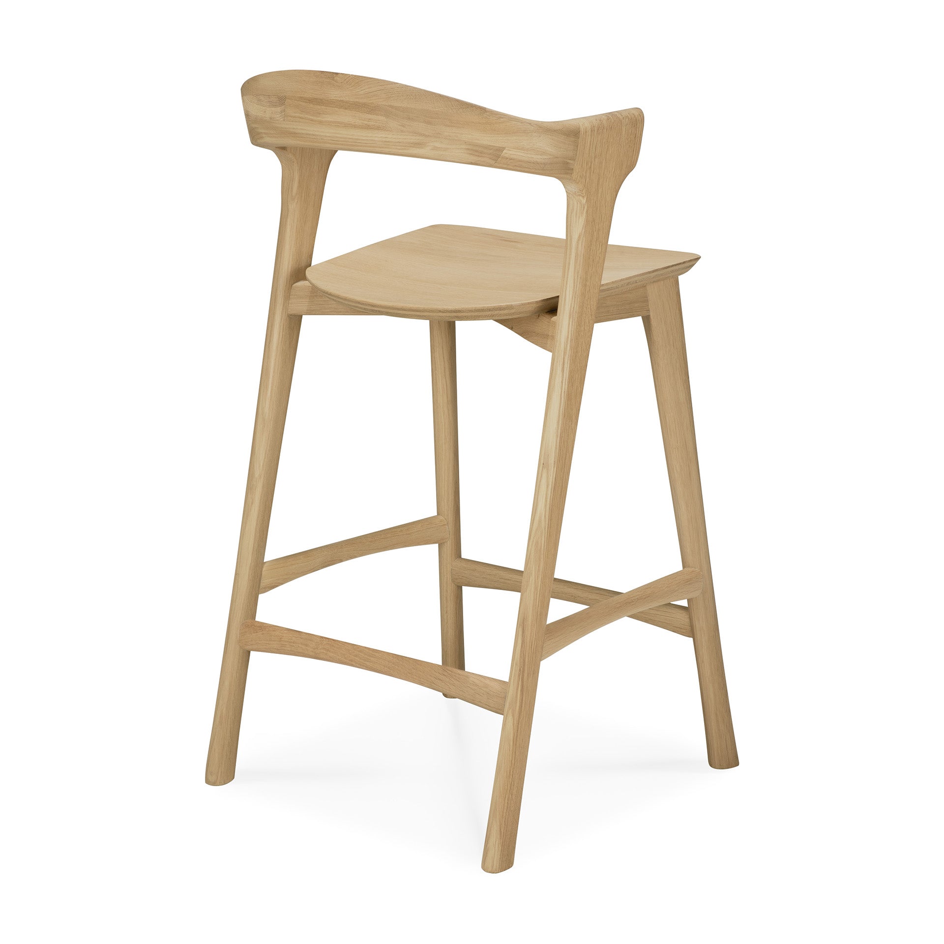 The Bok counter stool by Ethnicraft is a light solid oak bar stool with a curved backrest, minimalist design, four angled legs with horizontal supports, and a contoured flat seat inspired by the Bok dining chair.