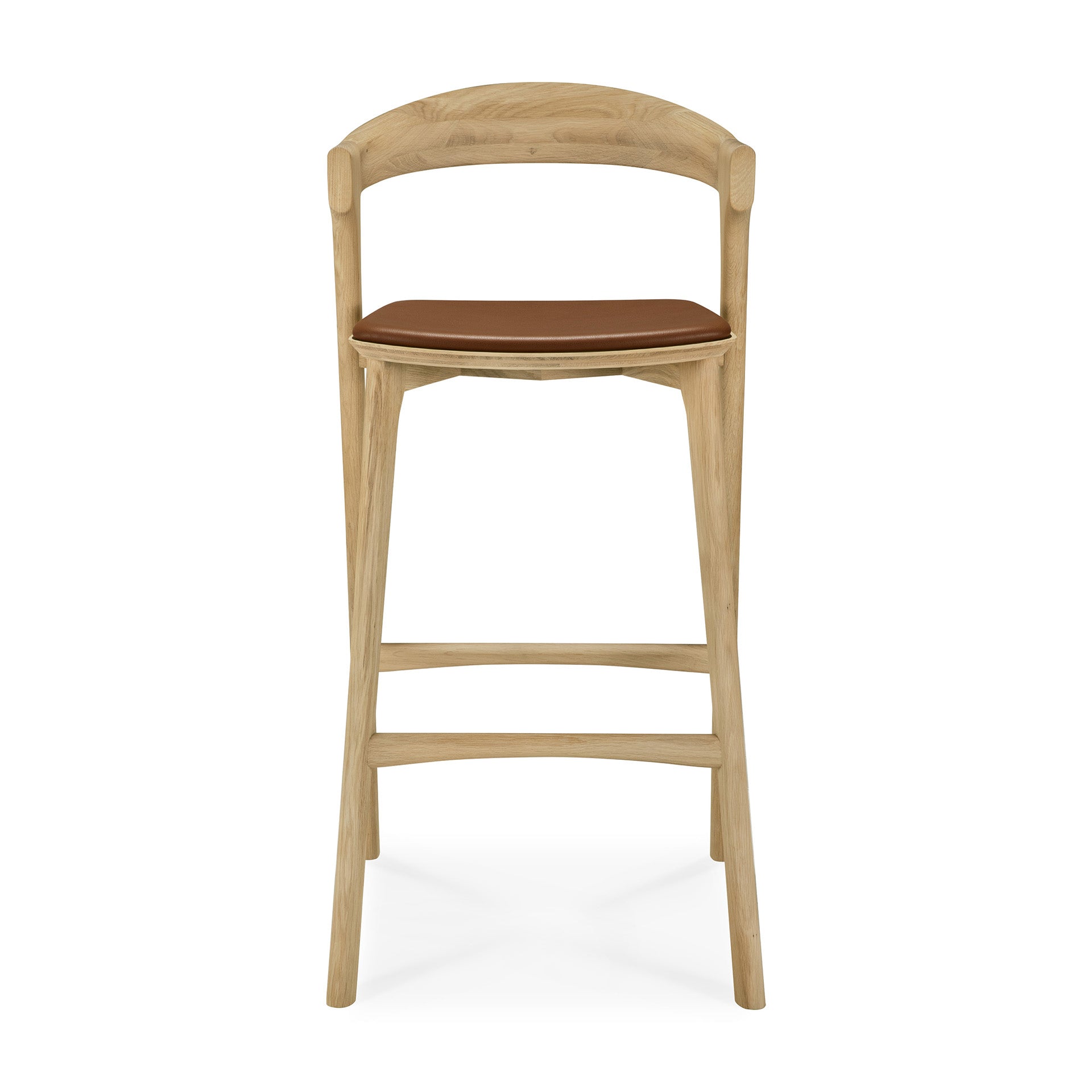 The Ethnicraft Bok bar stool in solid oak features a curved backrest and a brown cushioned seat, shown from the front on a white background.