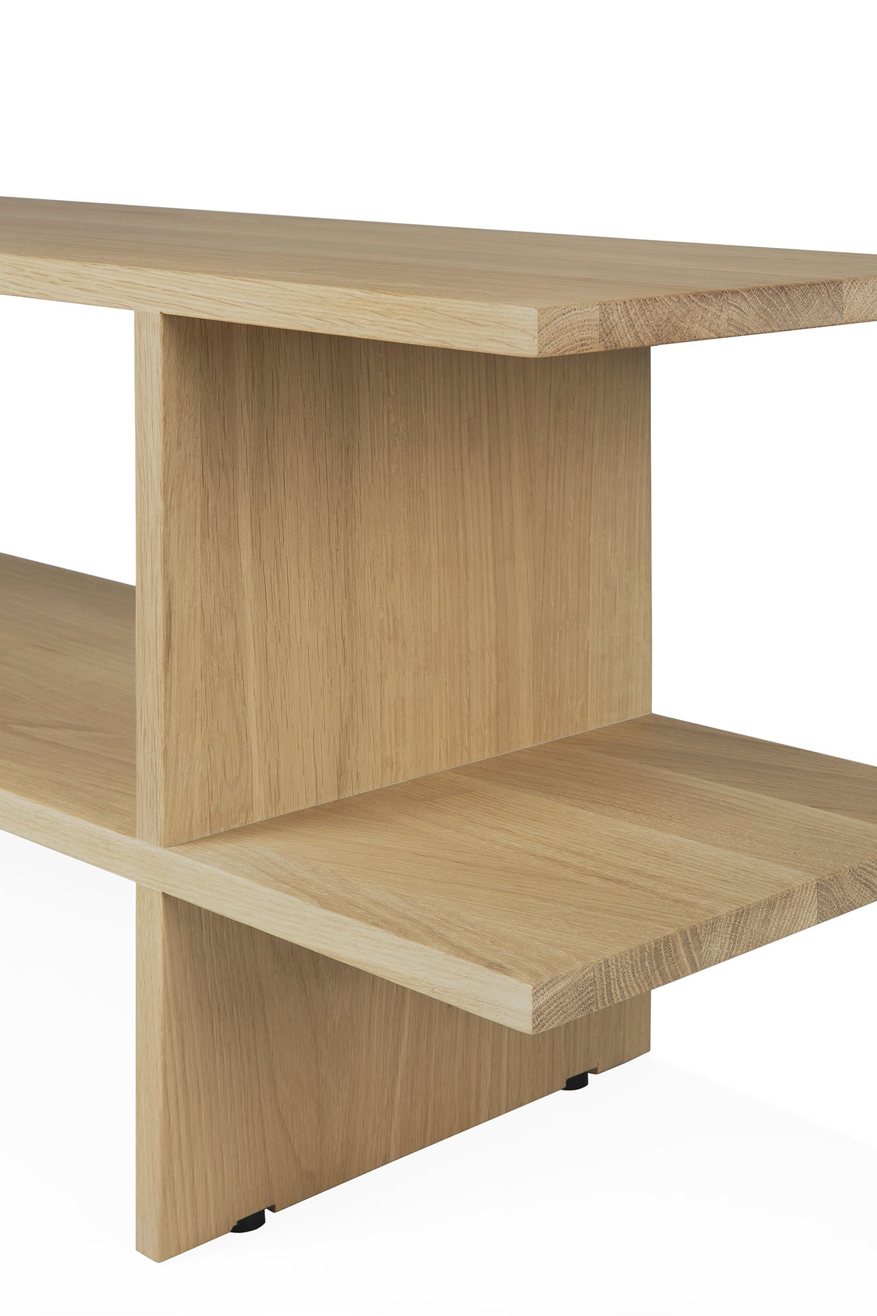 The Ethnicraft Kabuki Side Table in oak features a minimalist design with intersecting flat panels, open shelves, and clean lines, crafted from solid oak with a light finish.