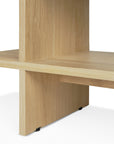 Close-up of intersecting flat oak panels forming the Kabuki Side Table by Ethnicraft, featuring a minimalist design with clean lines and a natural finish, set against a white background.