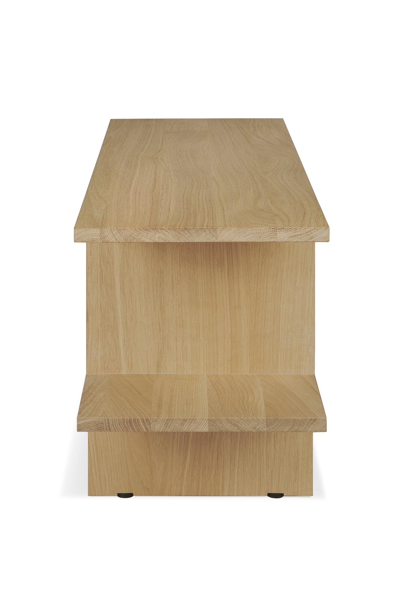 The Kabuki Side Table - Oak by Ethnicraft features a light oak finish, solid oak build, two tiers, and clean lines, showcasing a simple modern design when viewed from the side.