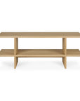 The Kabuki Side Table by Ethnicraft is crafted from solid oak and features open sides with a minimalist, modern design.