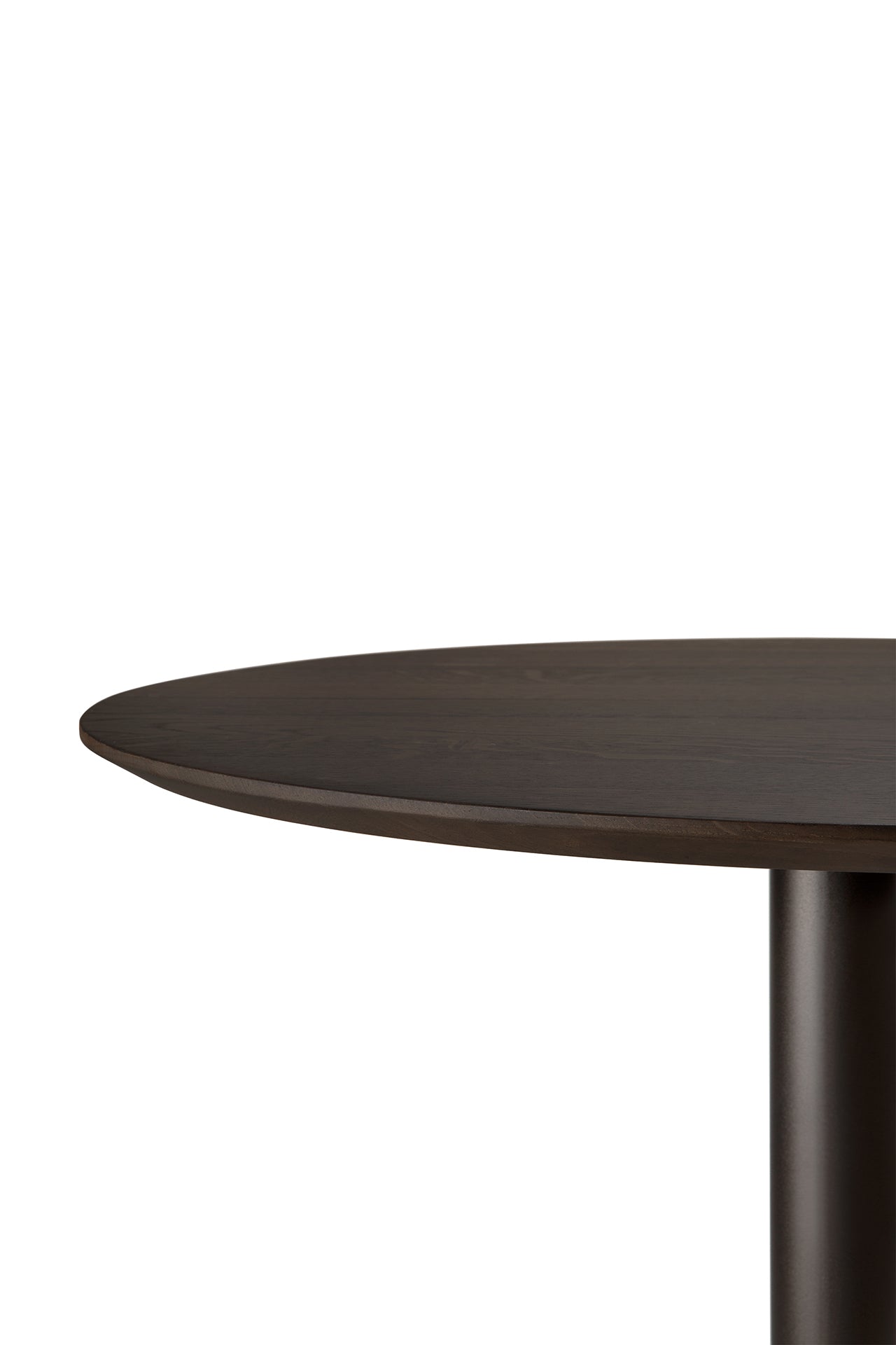 A close-up of the Ethnicraft Blend Dining Table - Brown Oak shows its round dark wood top and single cylindrical pedestal base against a plain white background.