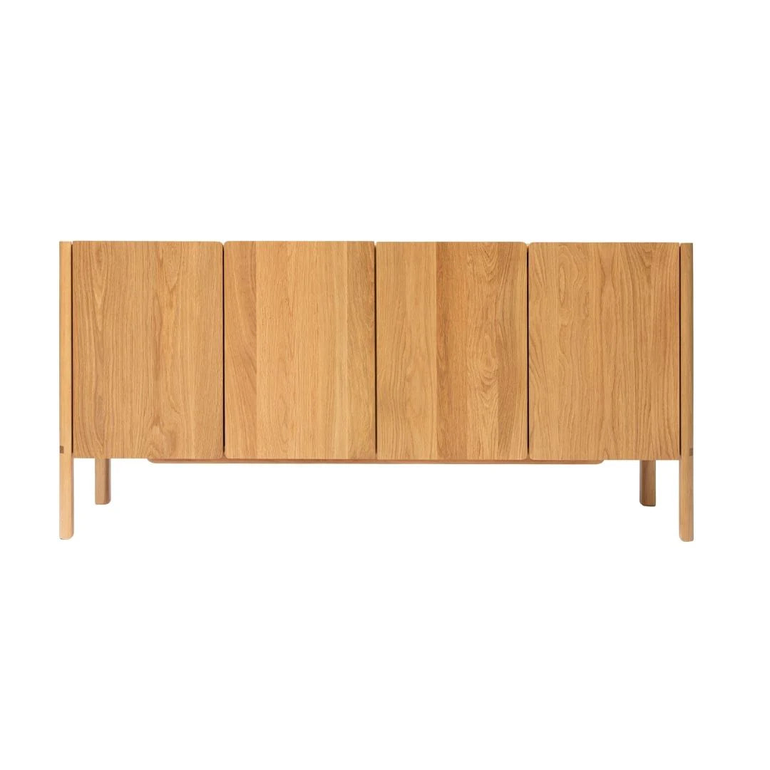 The Nell Sideboard by Wooden Stories features Danish-inspired design with four vertical doors, clean lines, and a natural light oak finish, providing ample storage on four straight legs.